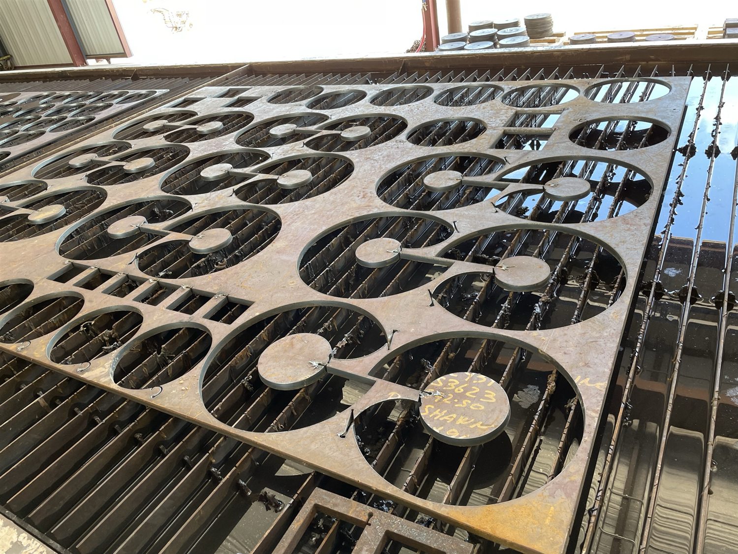 Fabricated plate scrap with torch-cut cutouts
