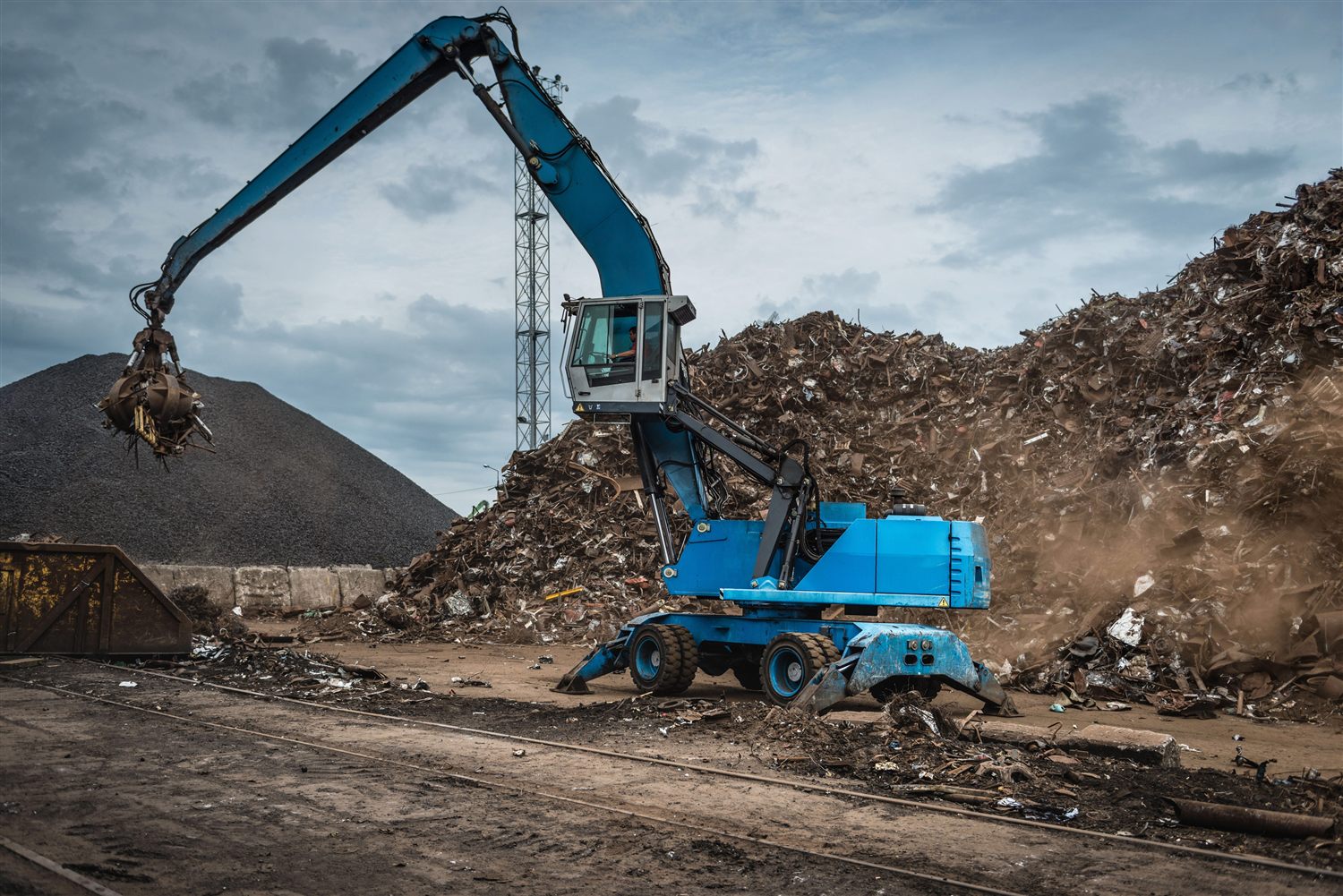 Material handler working the ferrous scrap pile at Gold Star Metals