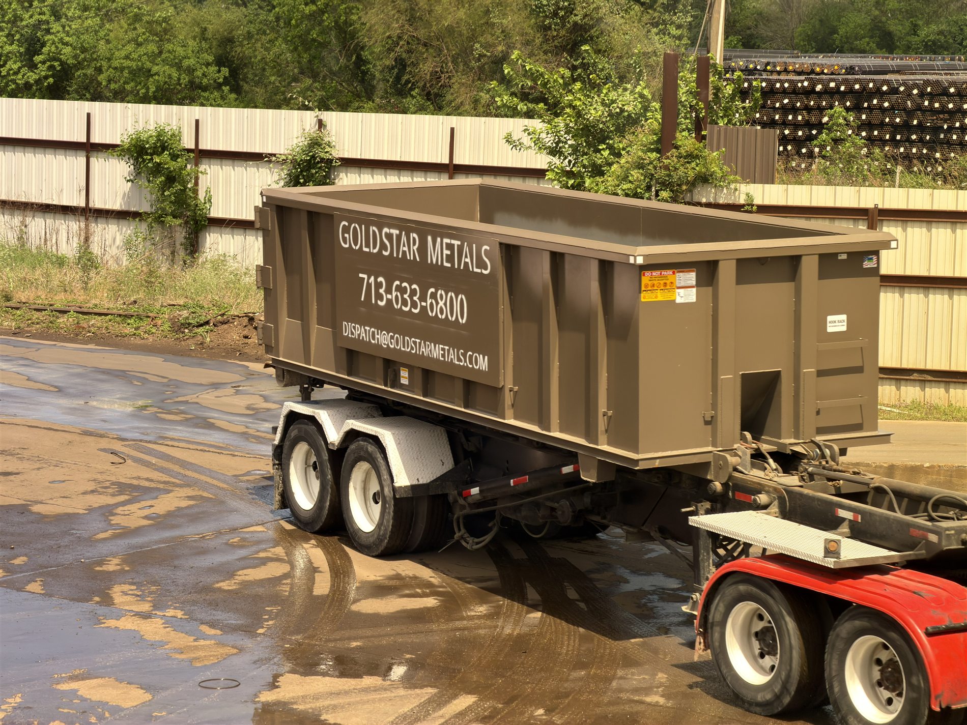 GSM-branded roll-off container for business scrap metal service in Houston