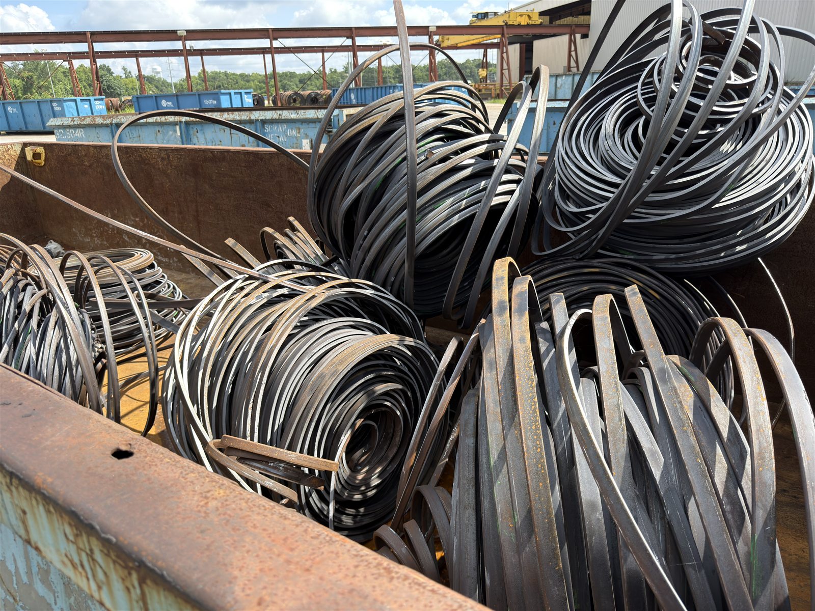 A Gold Star Metals roll-off container filled with steel scrap, ready for pickup