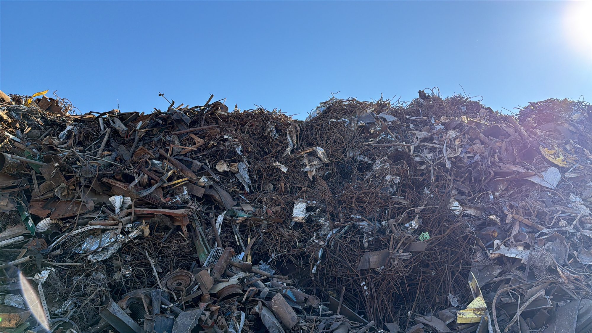 Towering wall of ferrous scrap at the Gold Star Metals Houston yard